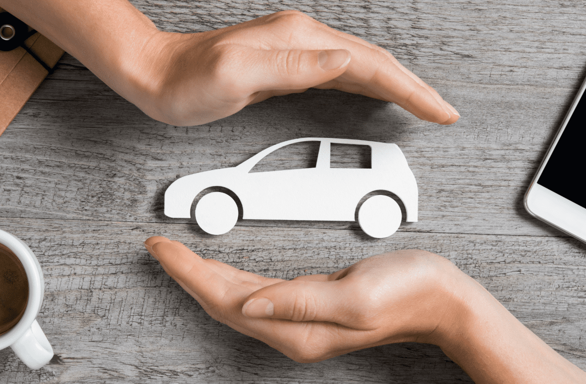 Car cutout cradled in by hands
