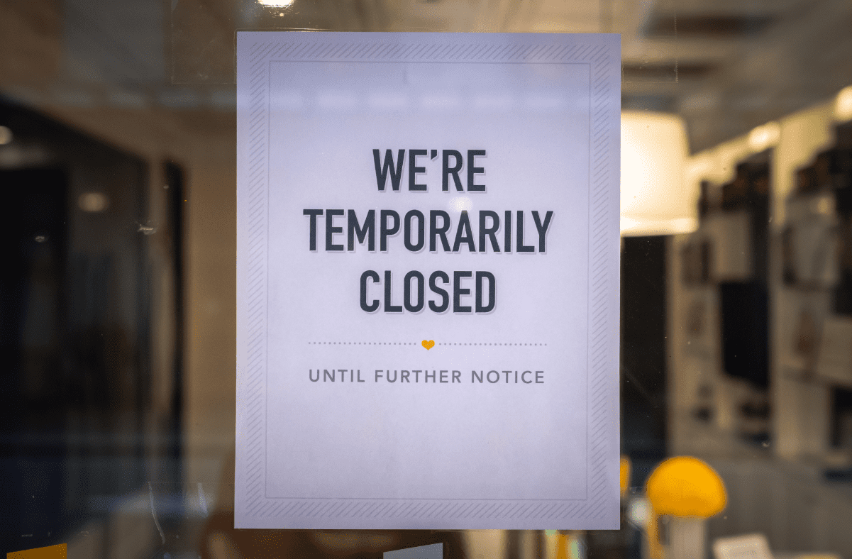 We're temporarily closed sign on business door