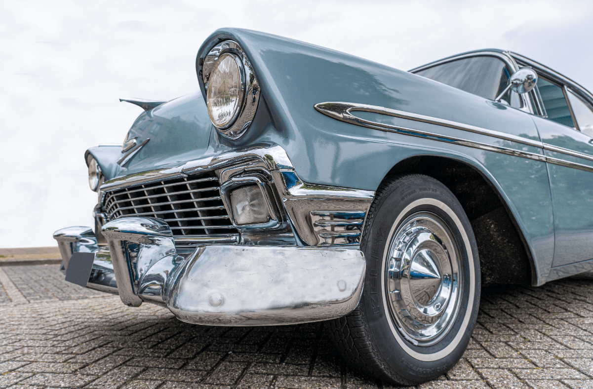 Front end of a light blue classic car