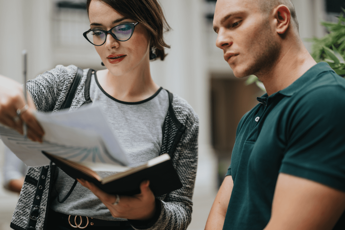 Man and woman reviewing documents