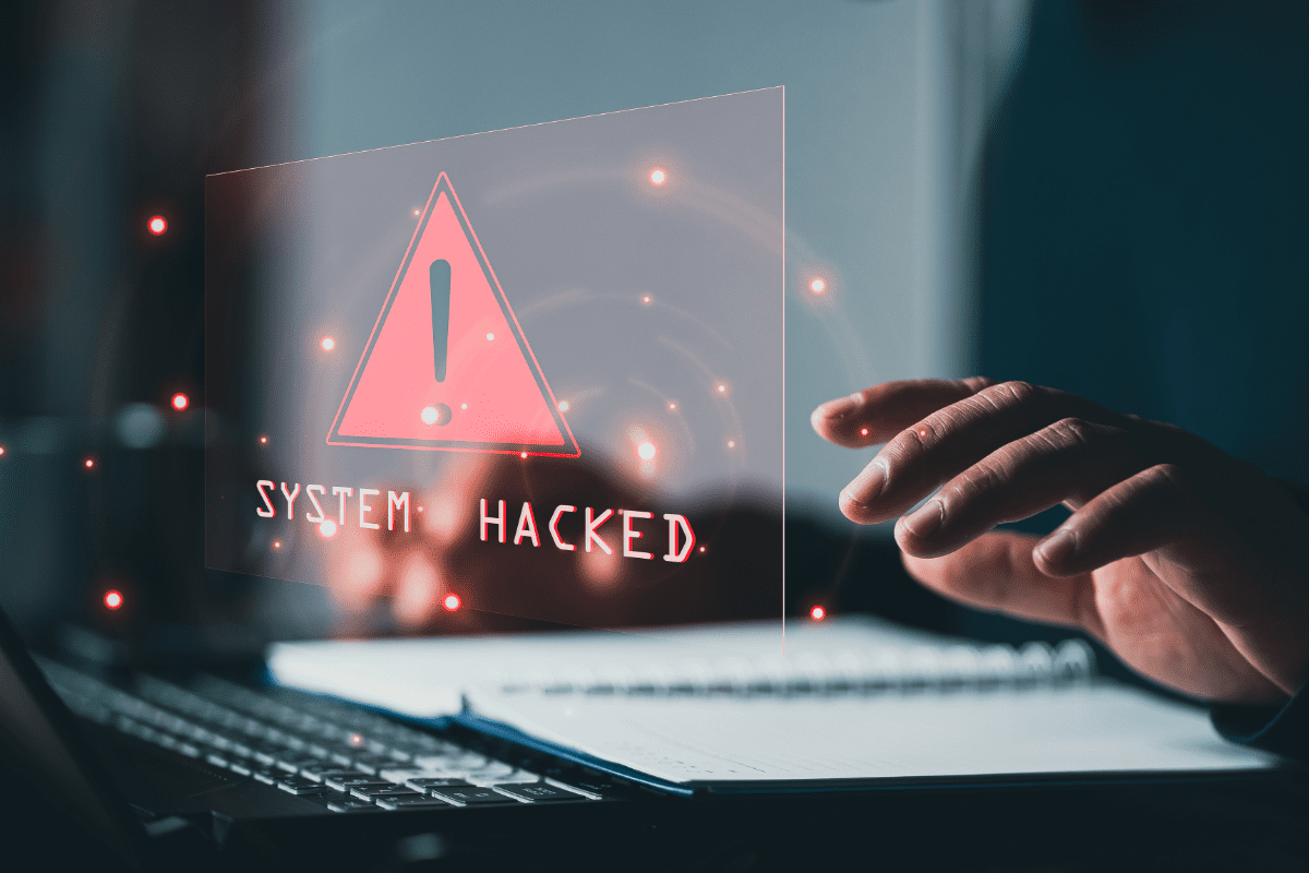 Computer screen with a system hacked alert