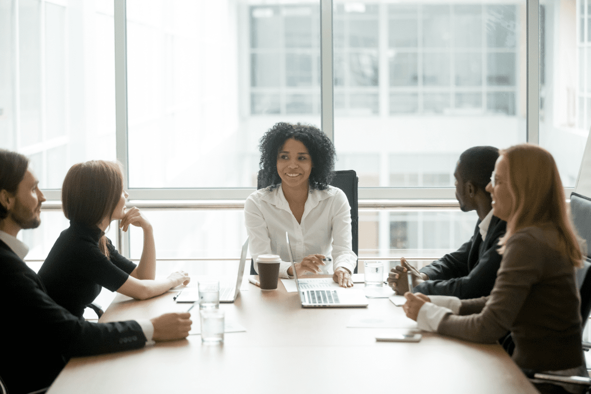 Board of directors sitting around a meeting table.