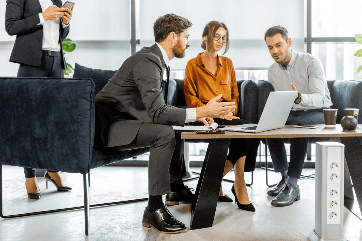 Business professionals meeting looking at a computer